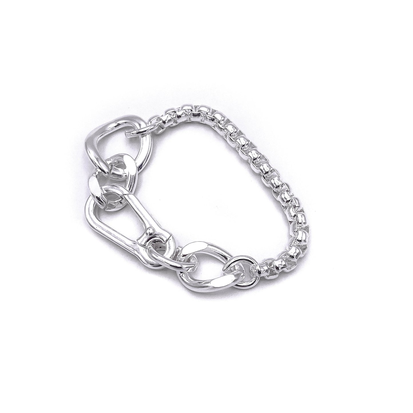 Chunky boxer-style chain bracelet; bold presence . Flats