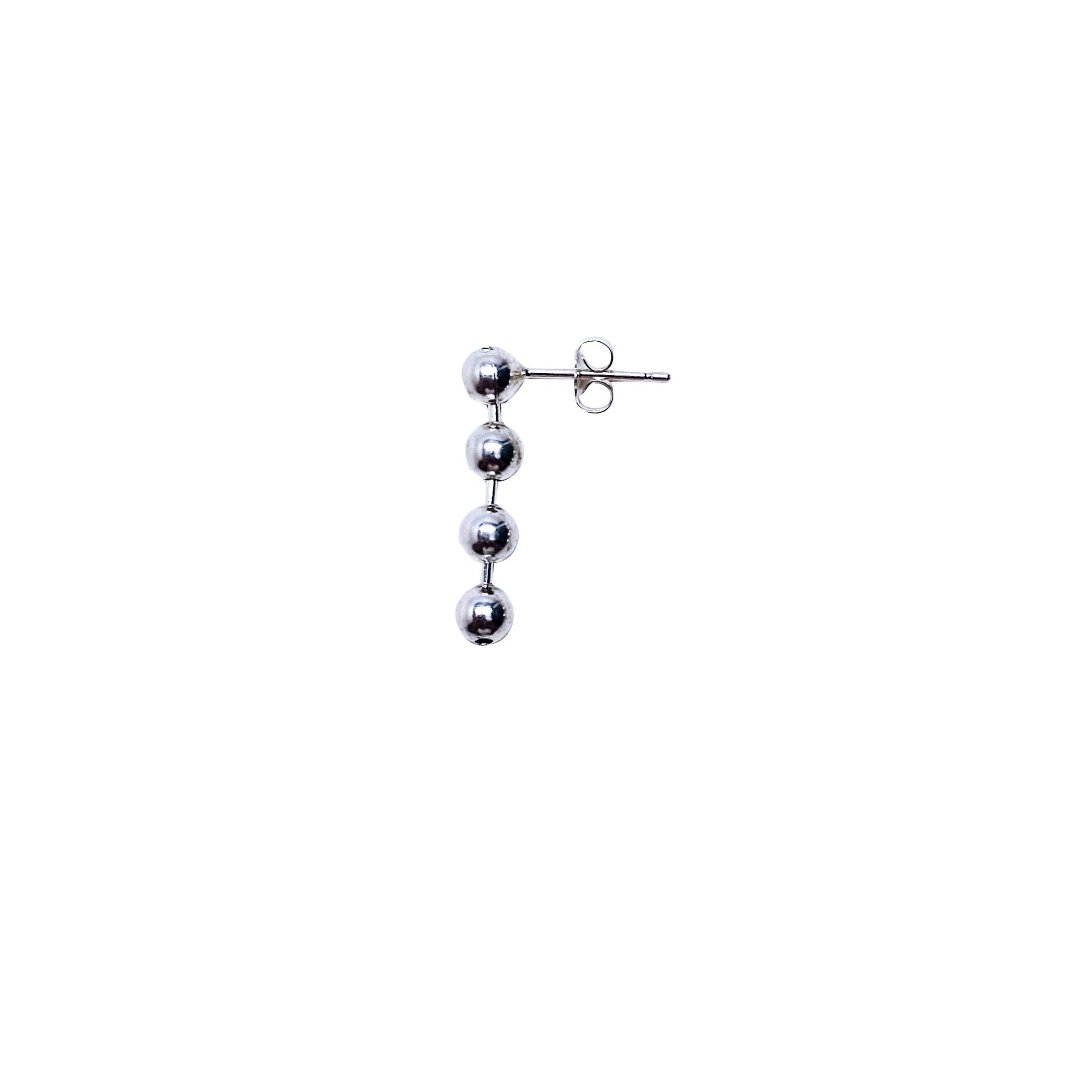 Spherical silver ball drop earring; playful and bold .