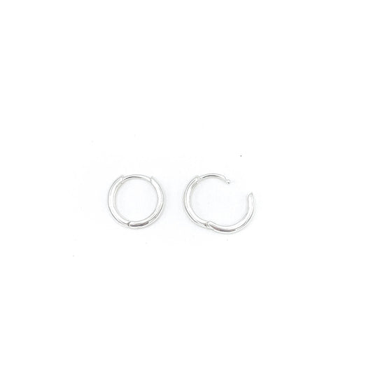Shop Martine Ali's Signature Silver Hoops. Signature sterling silver hoop earrings (set of 2) .