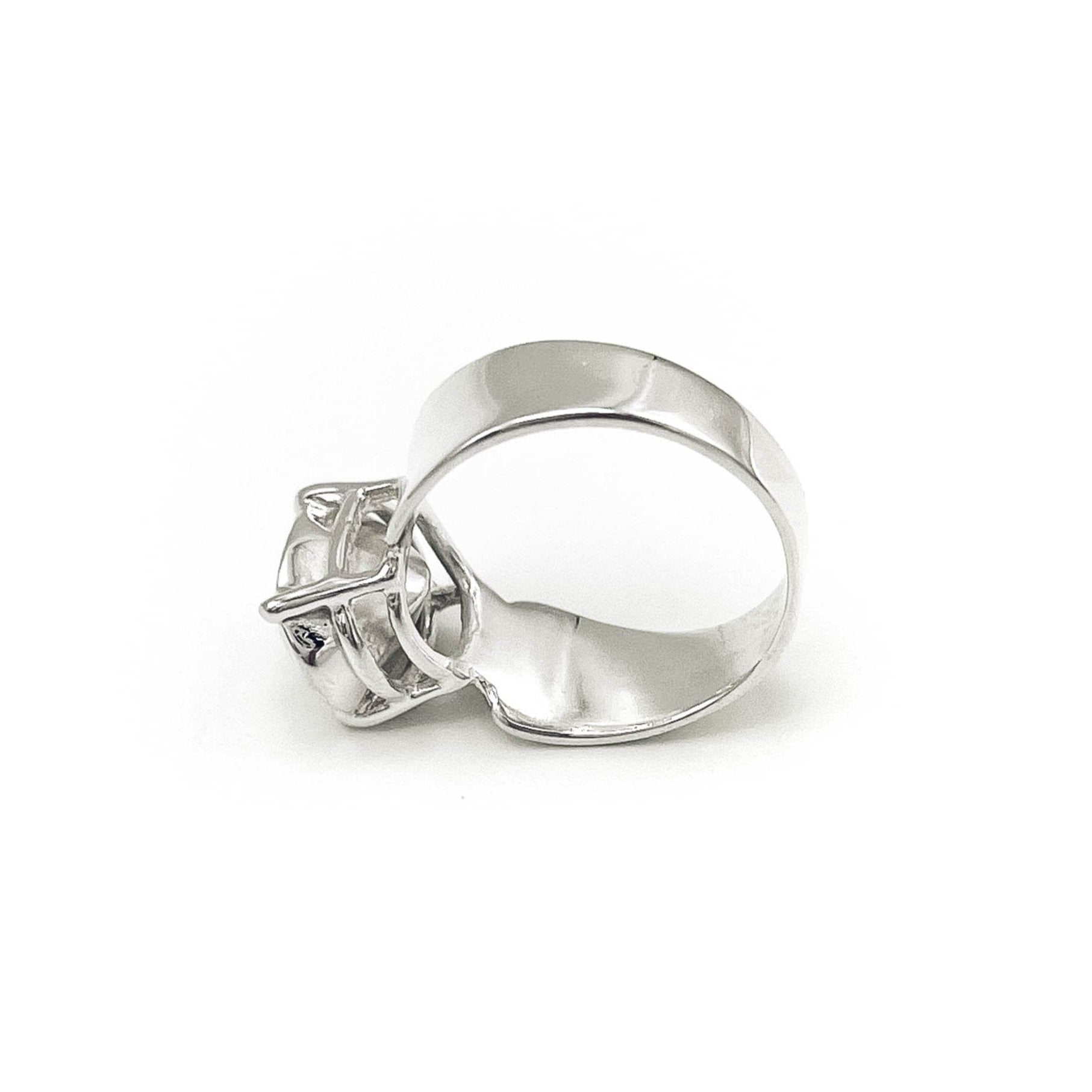 Sterling silver ring with silver stone setting . flat back