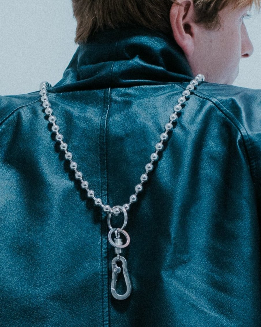Ball chain lanyard with clasp; functional and stylish . on body