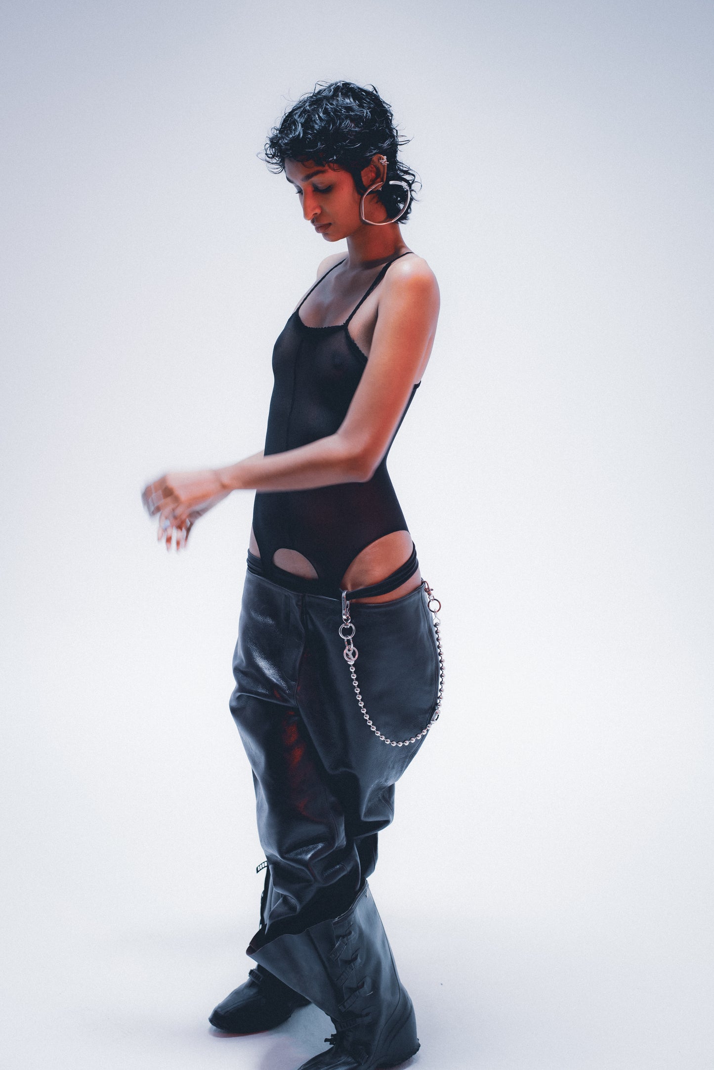 Edgy ball-link pant chain; distressed silver finish . on model 