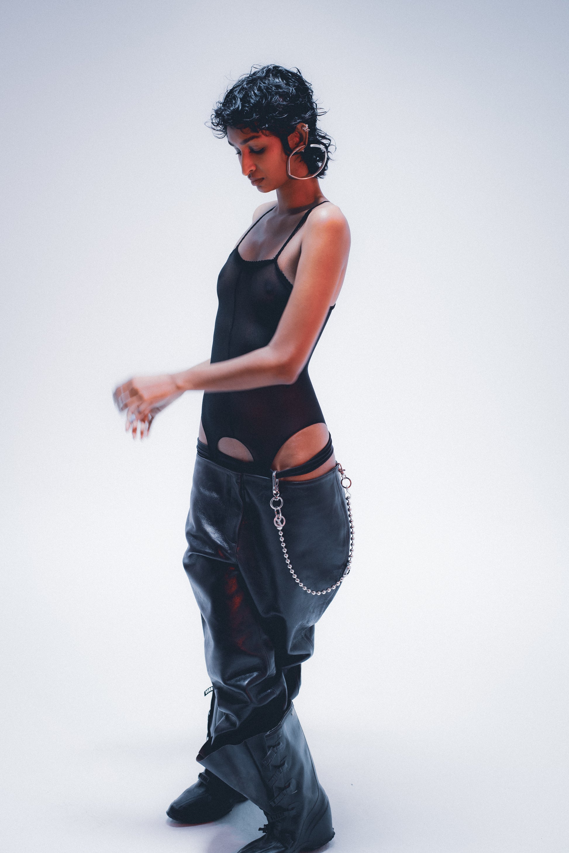 Edgy ball-link pant chain; distressed silver finish . on model 