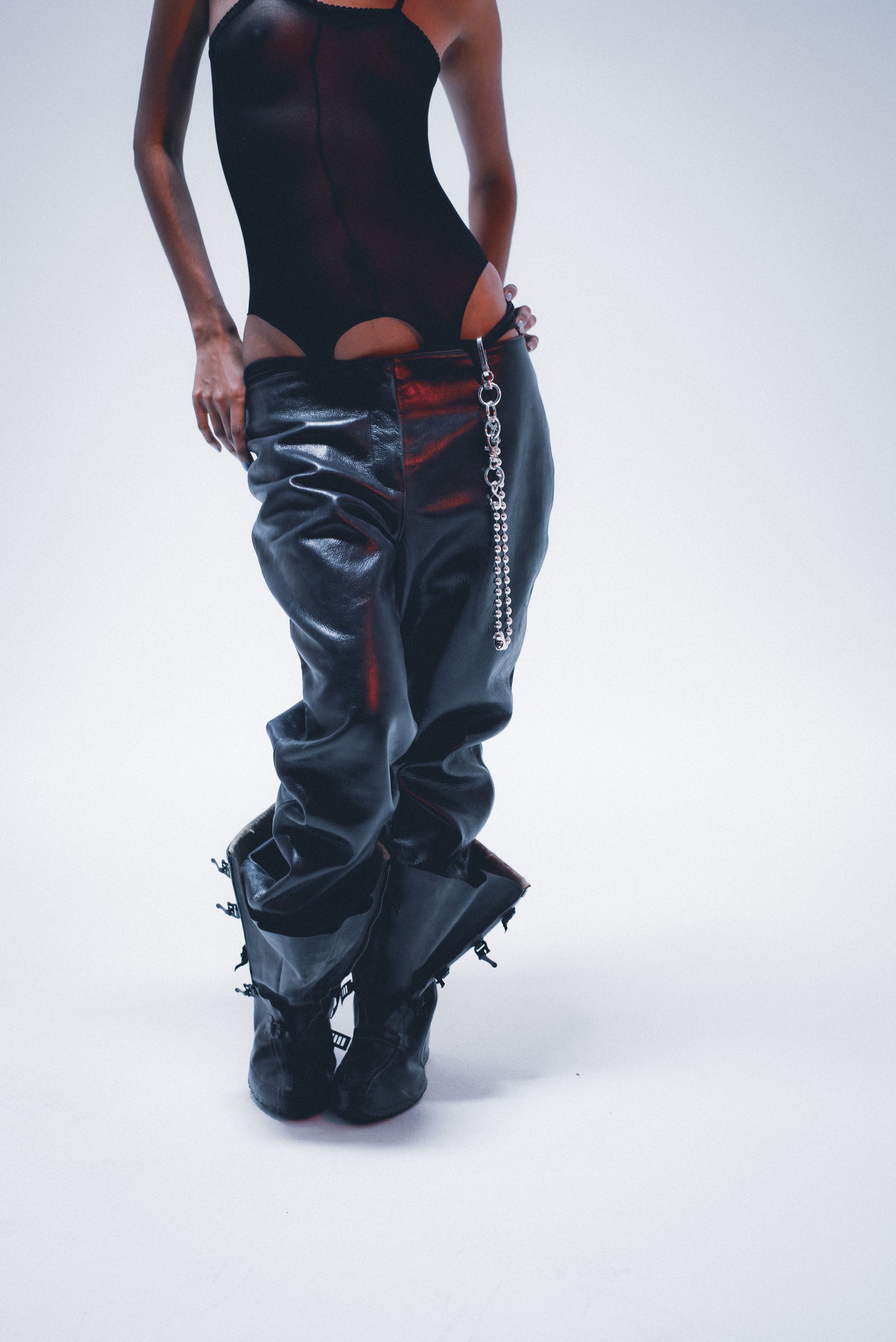 Edgy ball-link pant chain; distressed silver finish . on model