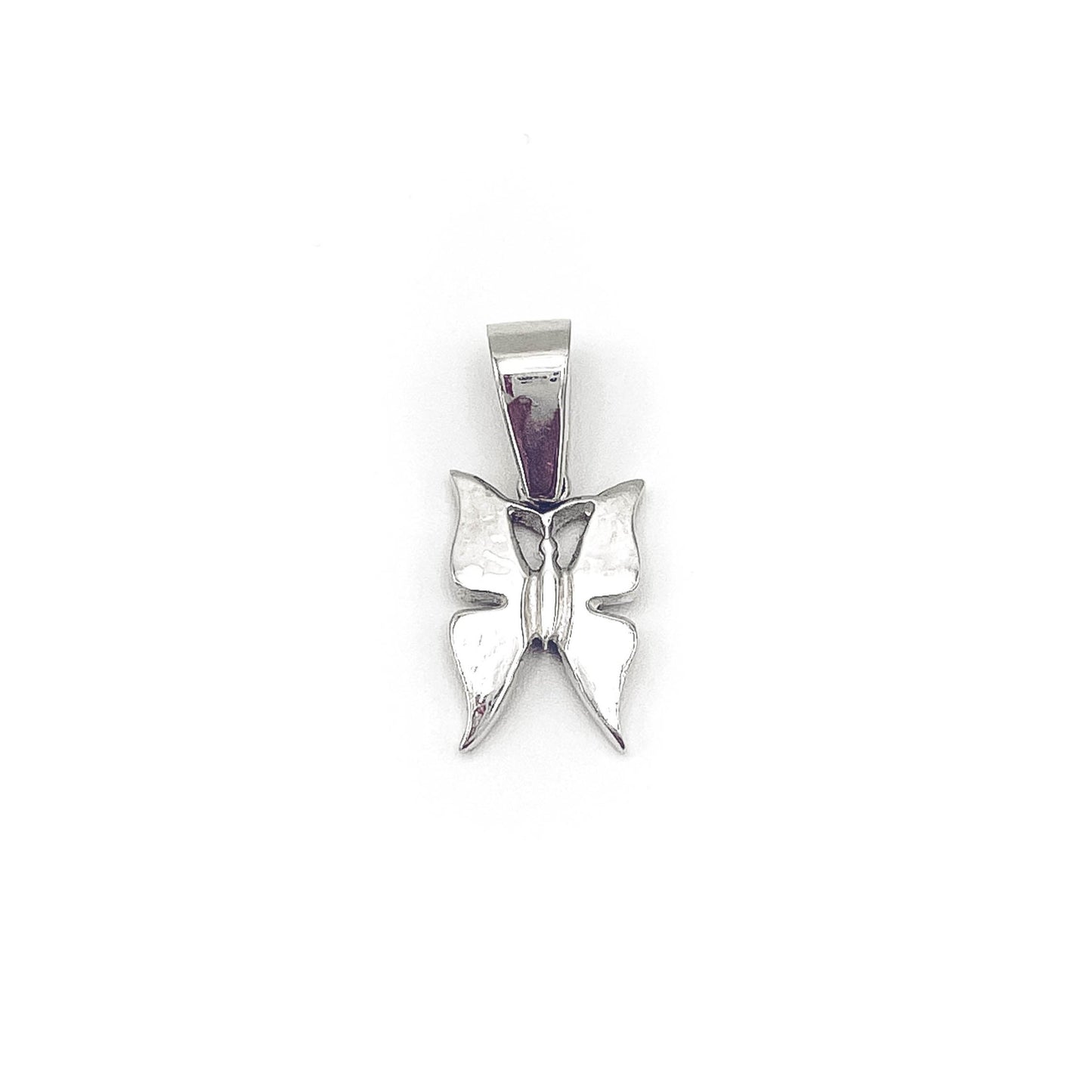 Playful butterfly charm pendant in silver . Flat