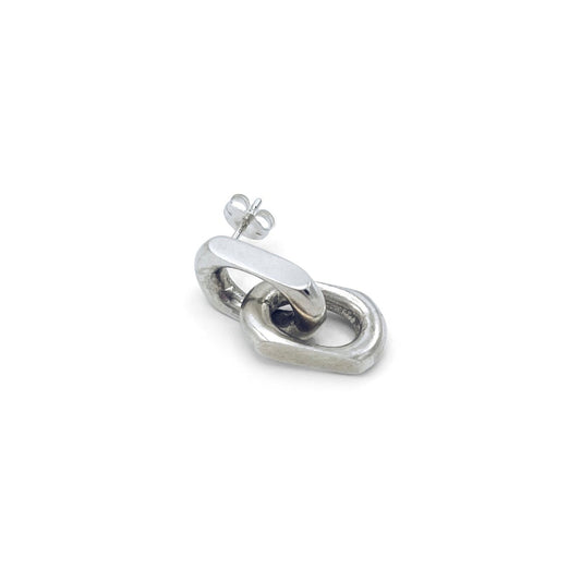 Drop earring featuring diamond-shaped link in silver . FLAT
