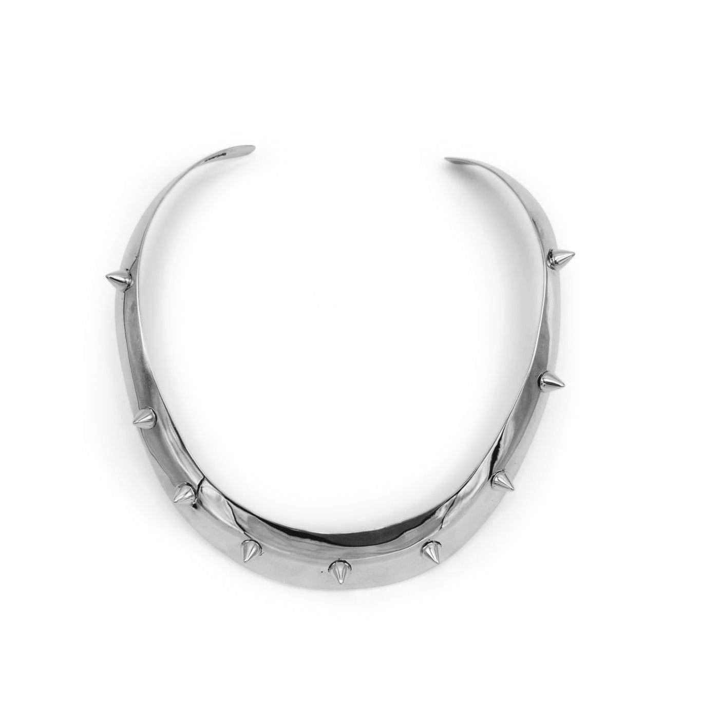 Silver crescent moon-shaped earring with spike details on a white background