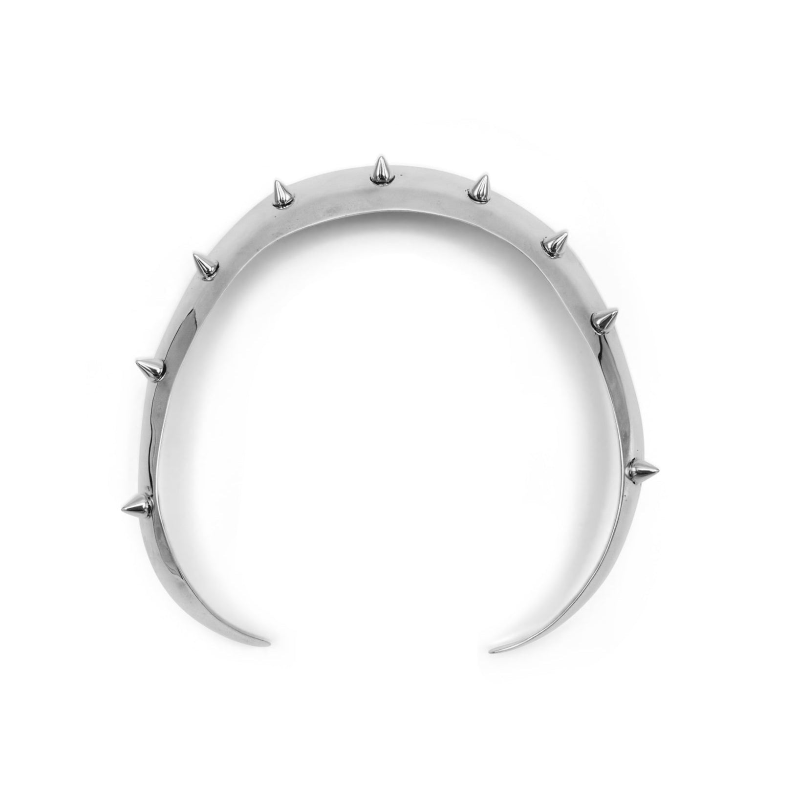 Silver crescent moon-shaped necklace with spikes on a white background