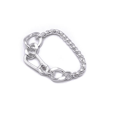 Chunky boxer-style chain bracelet; bold presence . Flats 