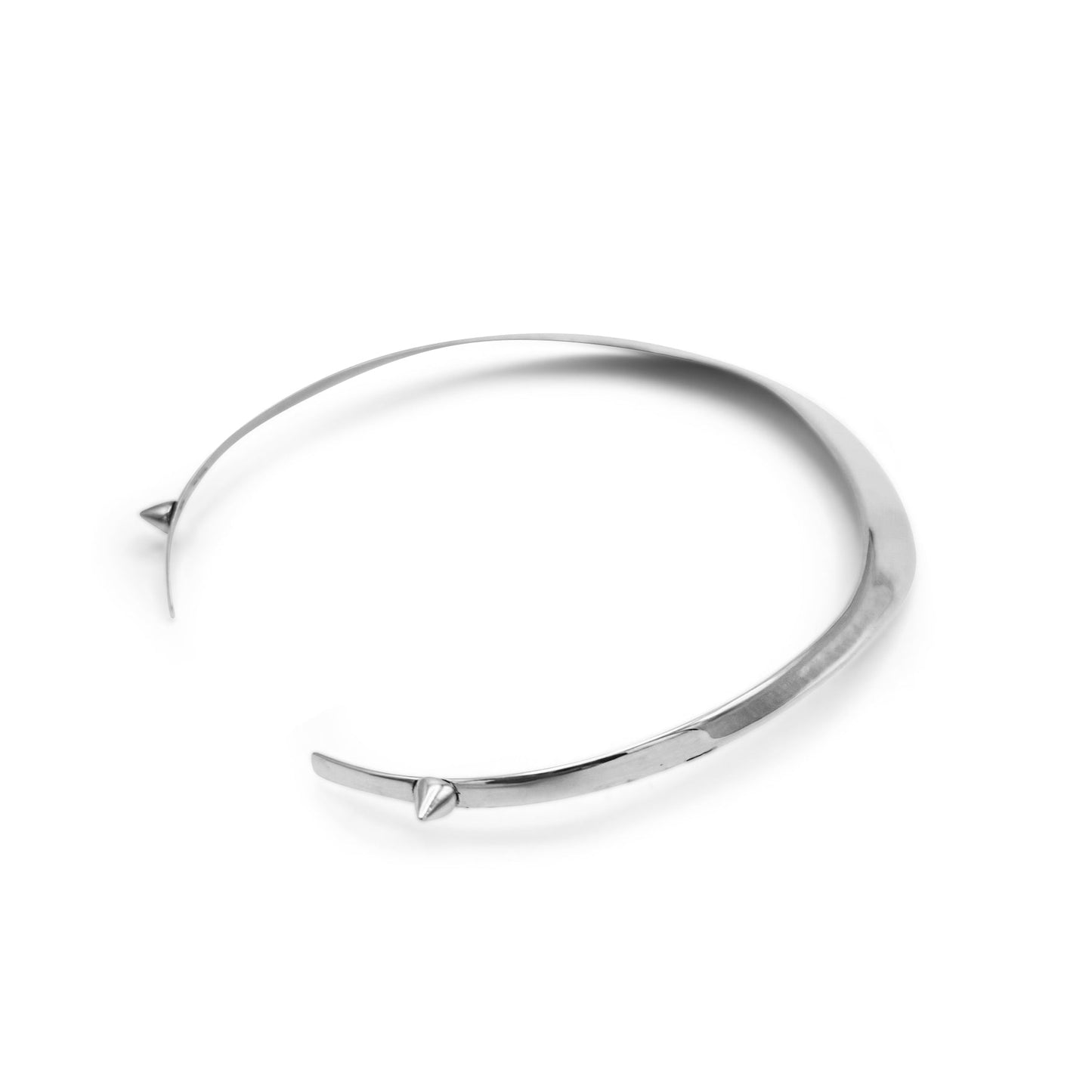 Silver bangle on a white background