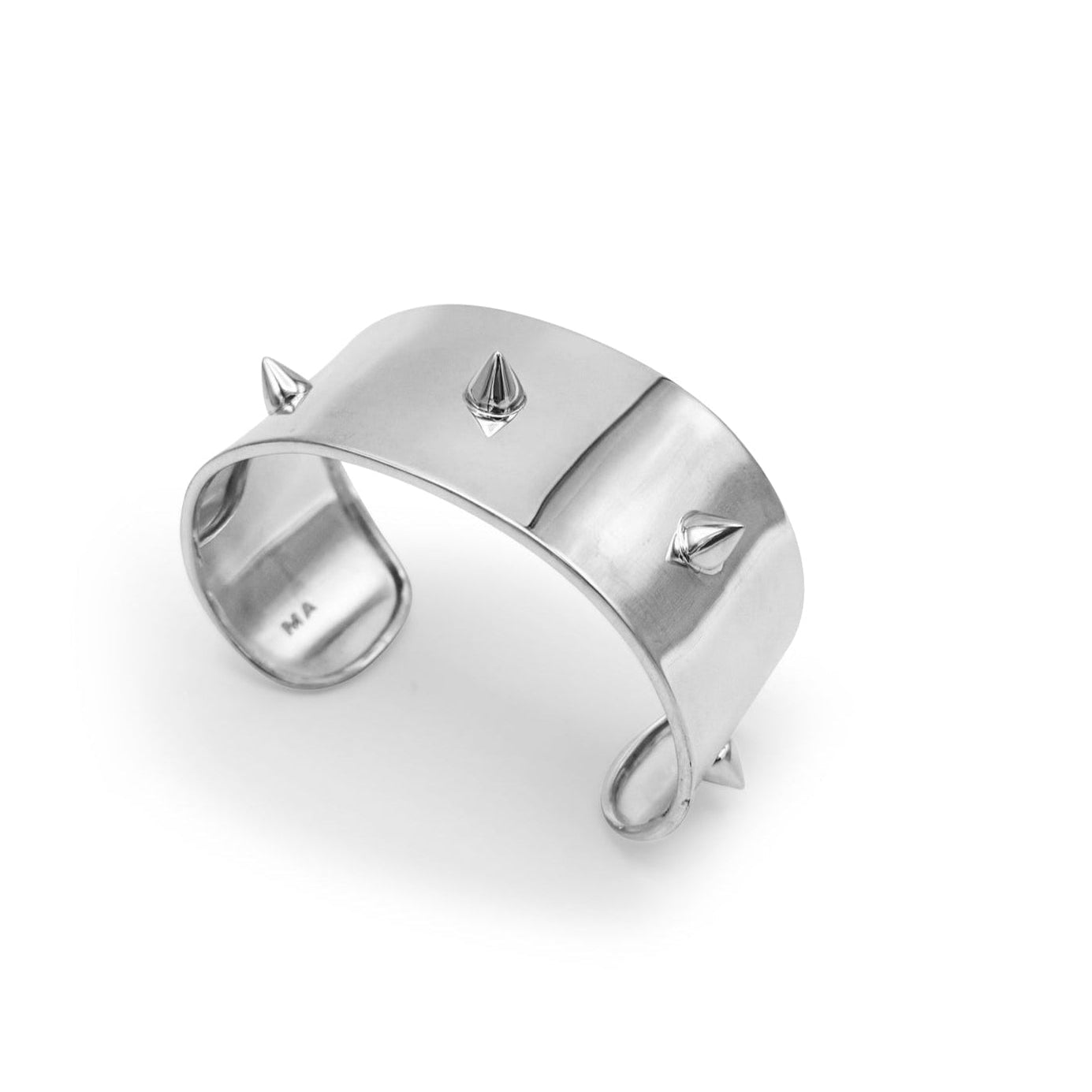 Silver ring with spikes on a white background