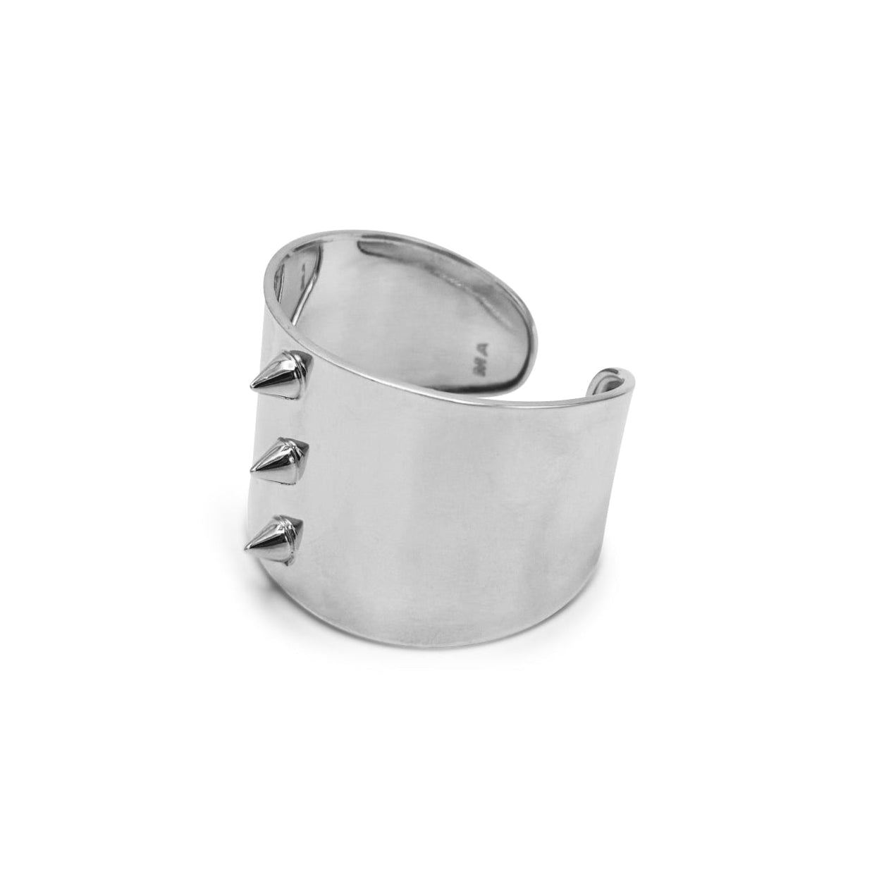 Silver ring with spikes on a white background