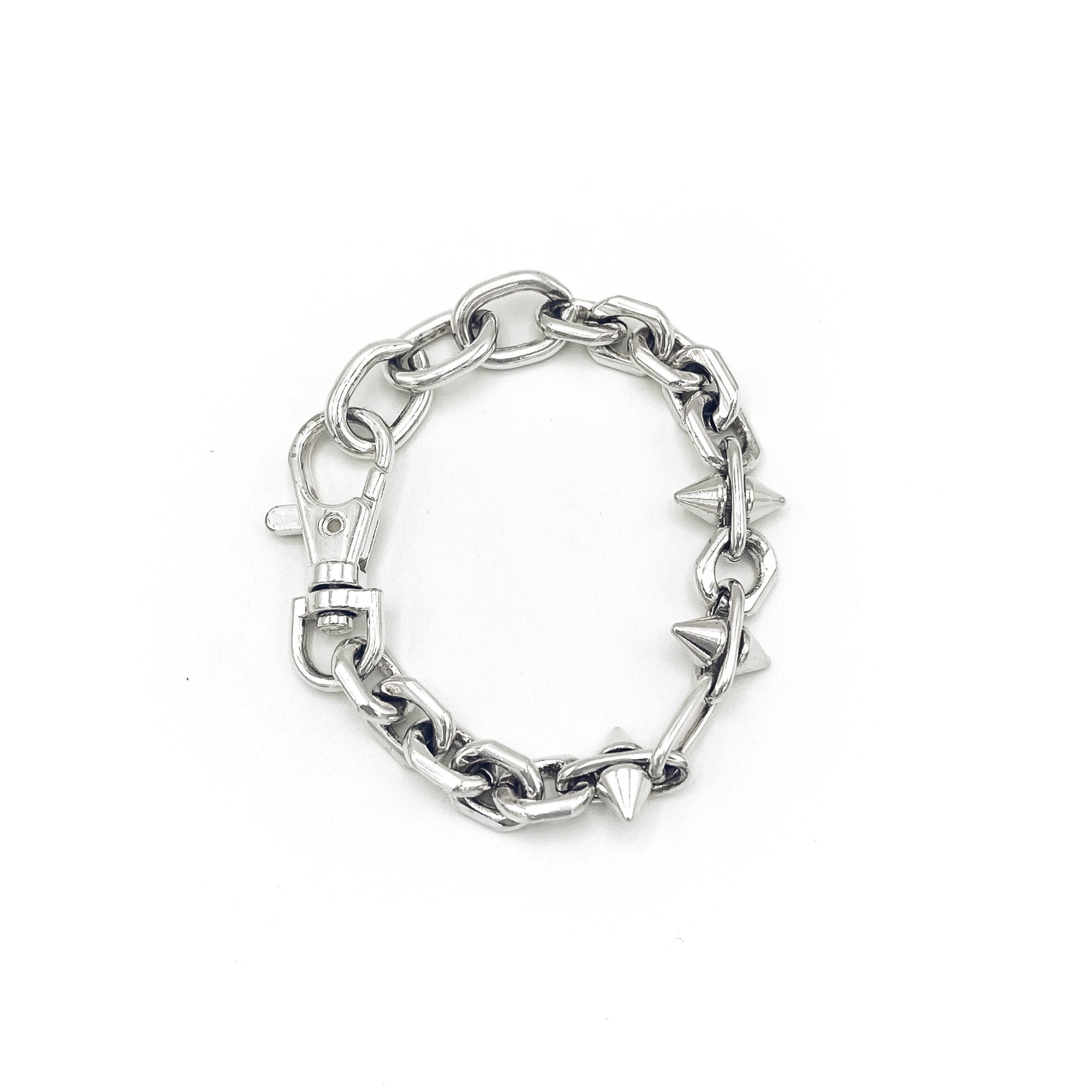 Edgy spike-accented chain bracelet; heirloom silver. FLATS