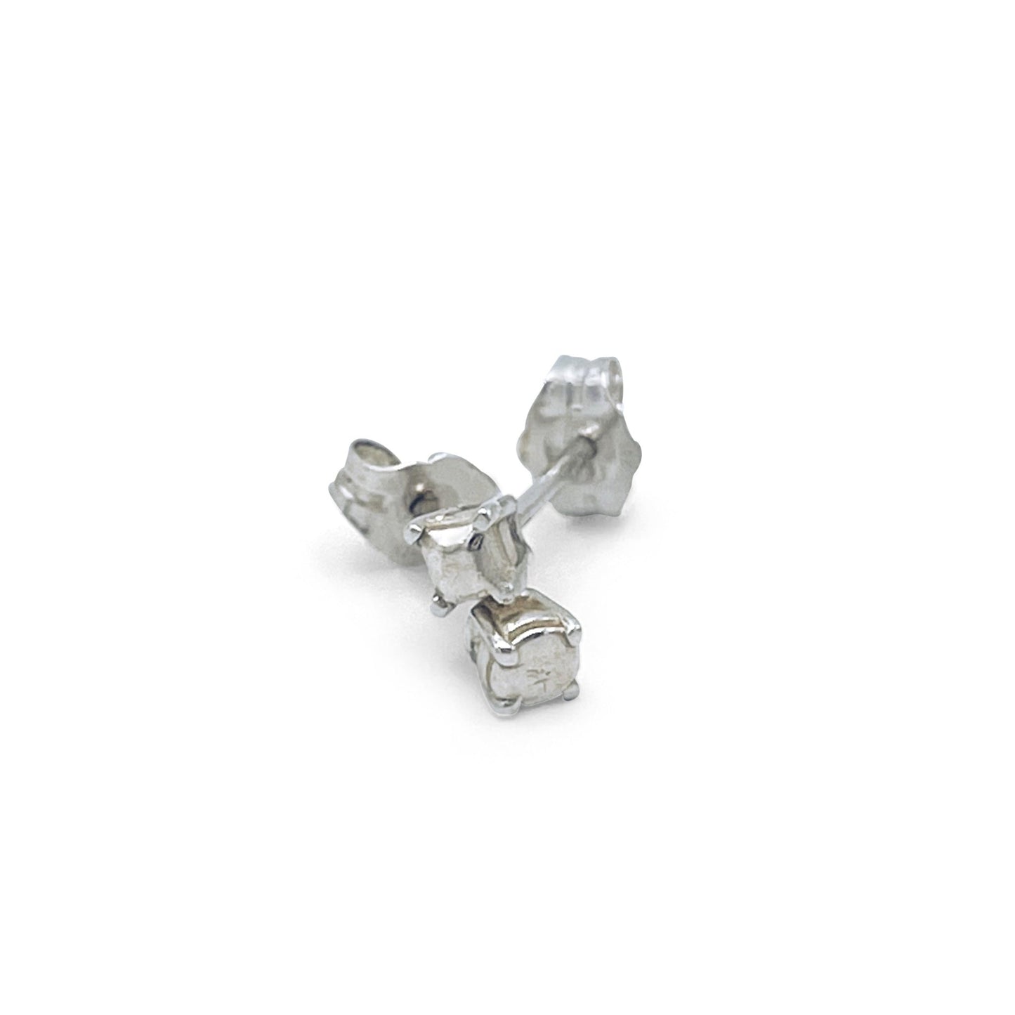 Mismatched Prince symbol stud earrings in silver.