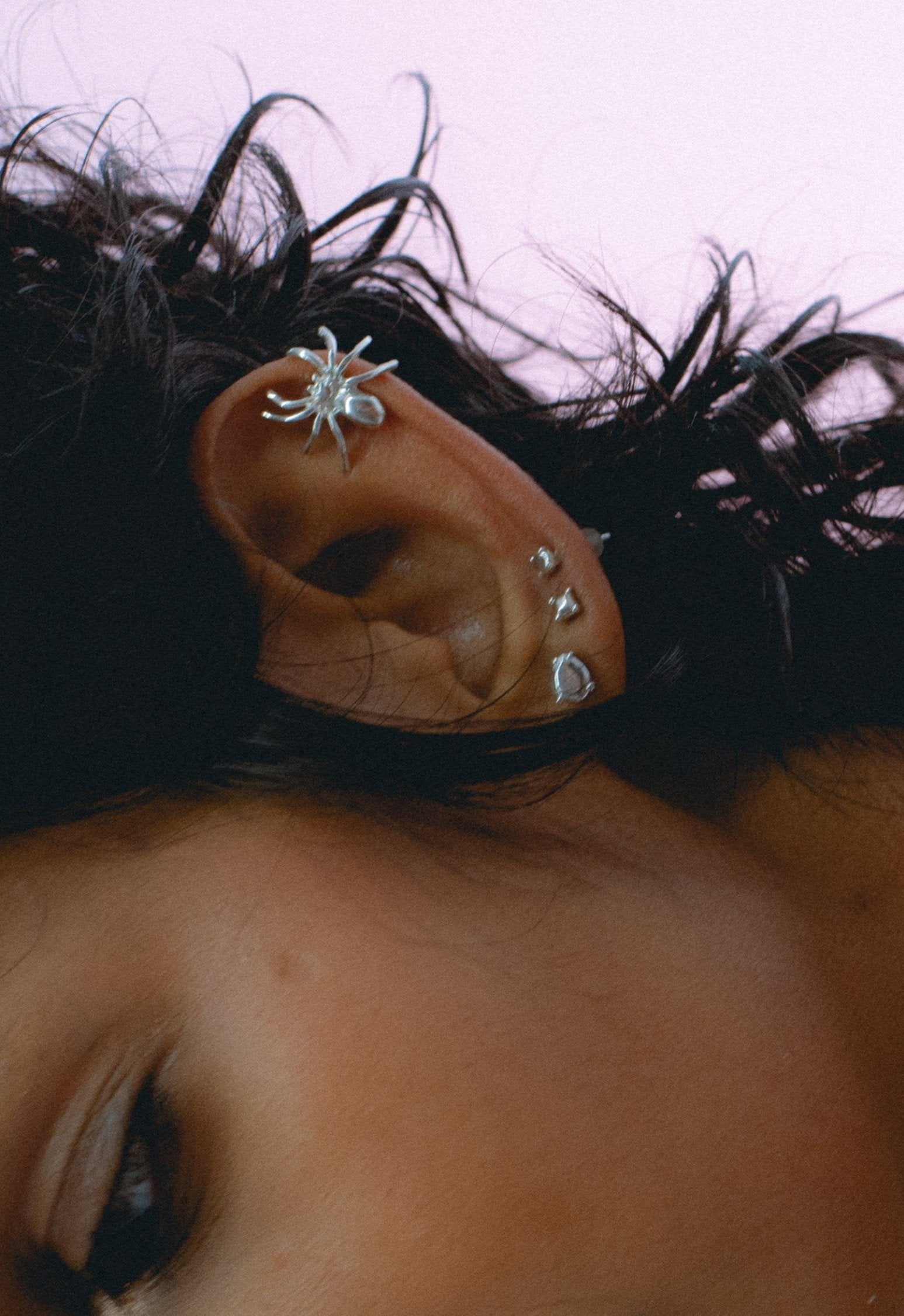 Mismatched Prince symbol stud earrings in silver.