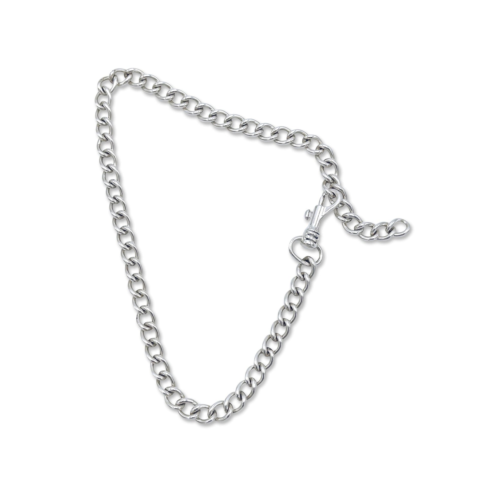 Bold safety-pin inspired chain links; heirloom silver.