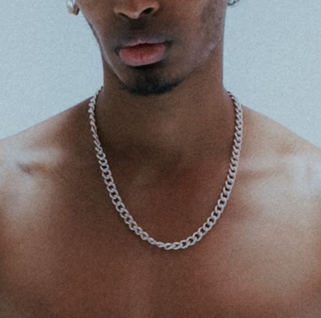 Bold safety-pin inspired chain links; heirloom silver .