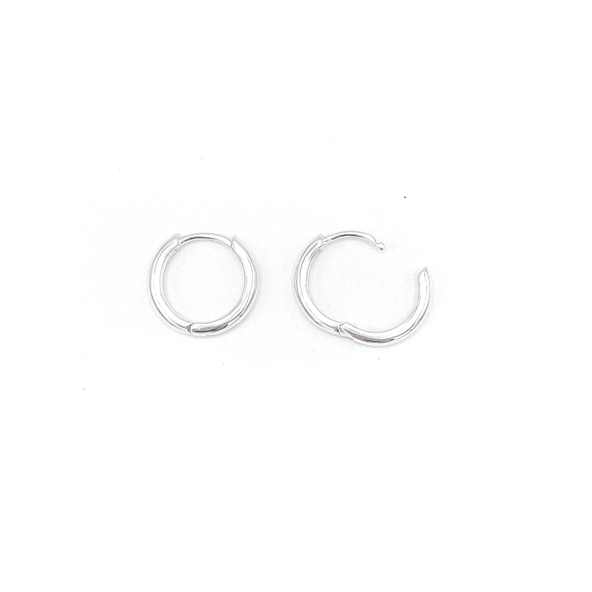 Shop Martine Ali's Signature Silver Hoops. Signature sterling silver hoop earrings (set of 2) .