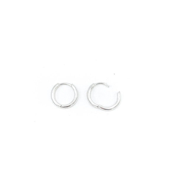 Shop Martine Ali's Signature Silver Hoops. Signature sterling silver hoop earrings (set of 2) .