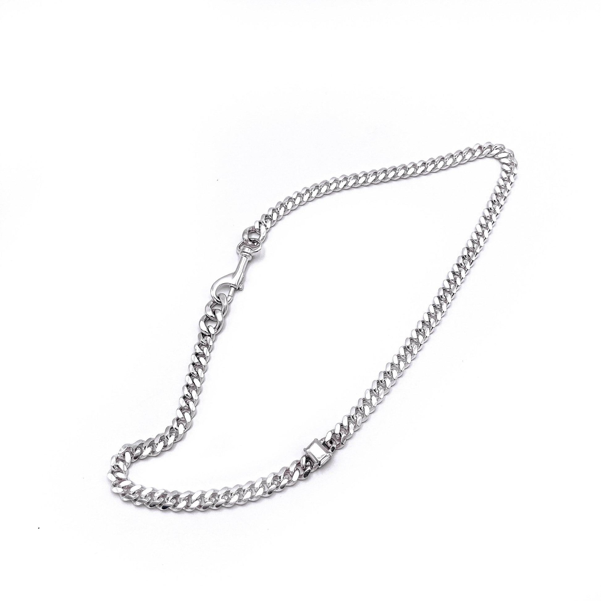 Thin link bracelet with silver stone accents . flat