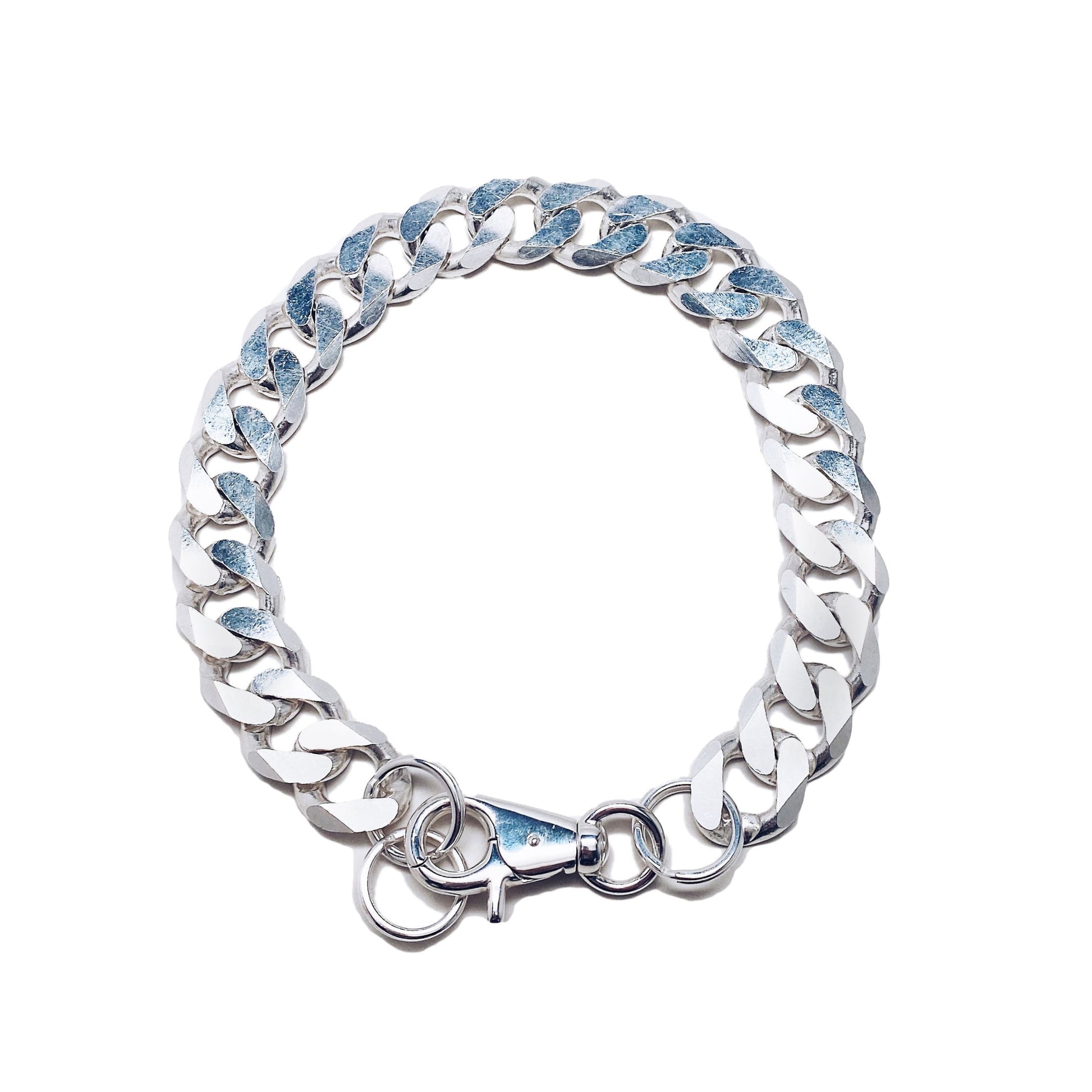 Oversized flat link chain design; bold statement piece.