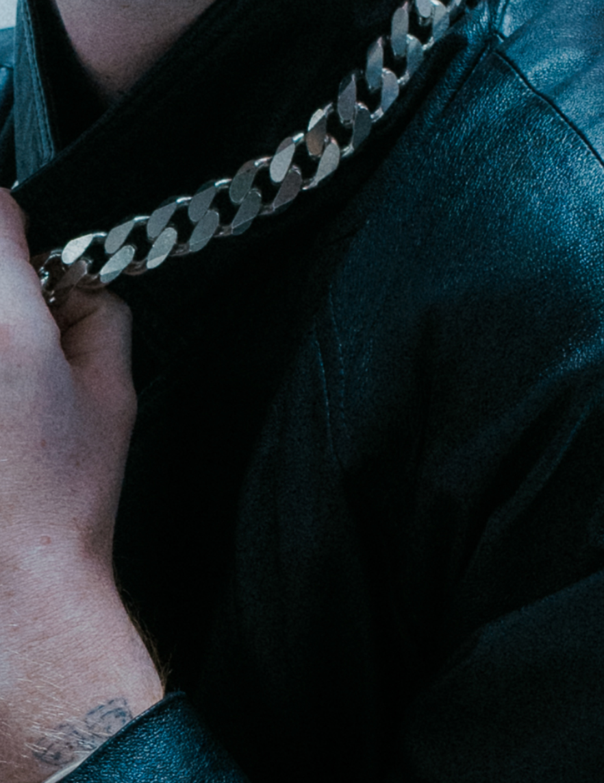 Oversized flat link chain design; bold statement piece.