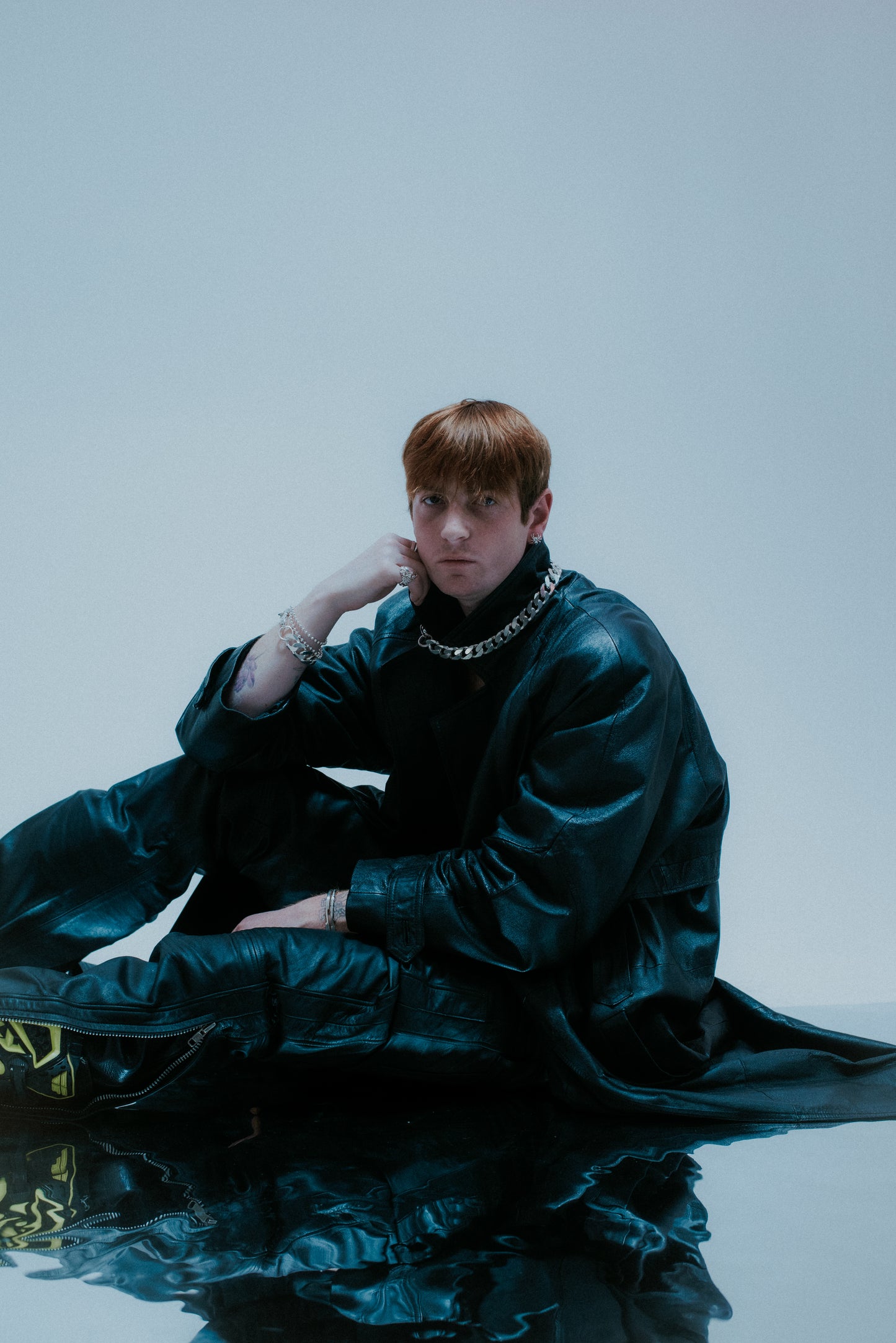 Oversized flat link chain design; bold statement piece.